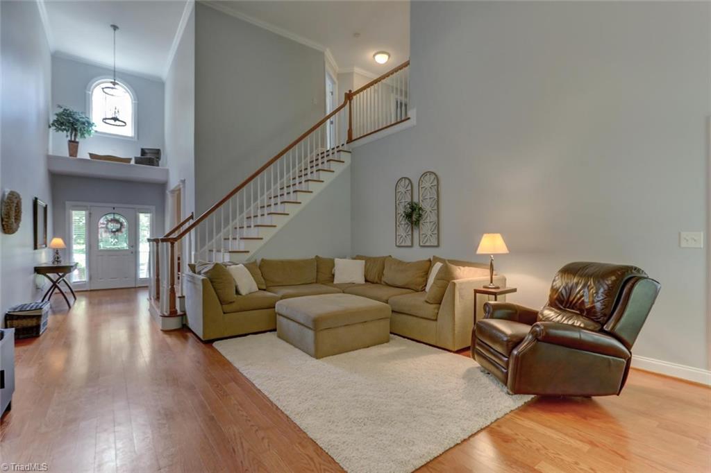 605 Stafford Pointe Court Oak Ridge, NC 27310 - Photo 7 of 30 Here's another look from the opposite end of the great room towards the foyer and staircase