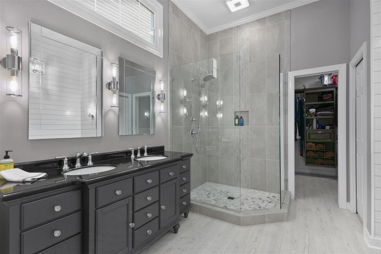 12205 Arneson Street Raleigh, NC 27614 - Photo 18 of 30 This en suite is just STUNNING! Every detail was well thought out from the light fixtures, to the mirrors, frameless shower, free standing tub. Stunning updated en suite