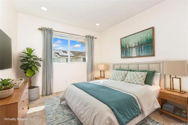 a bedroom with bed and large window