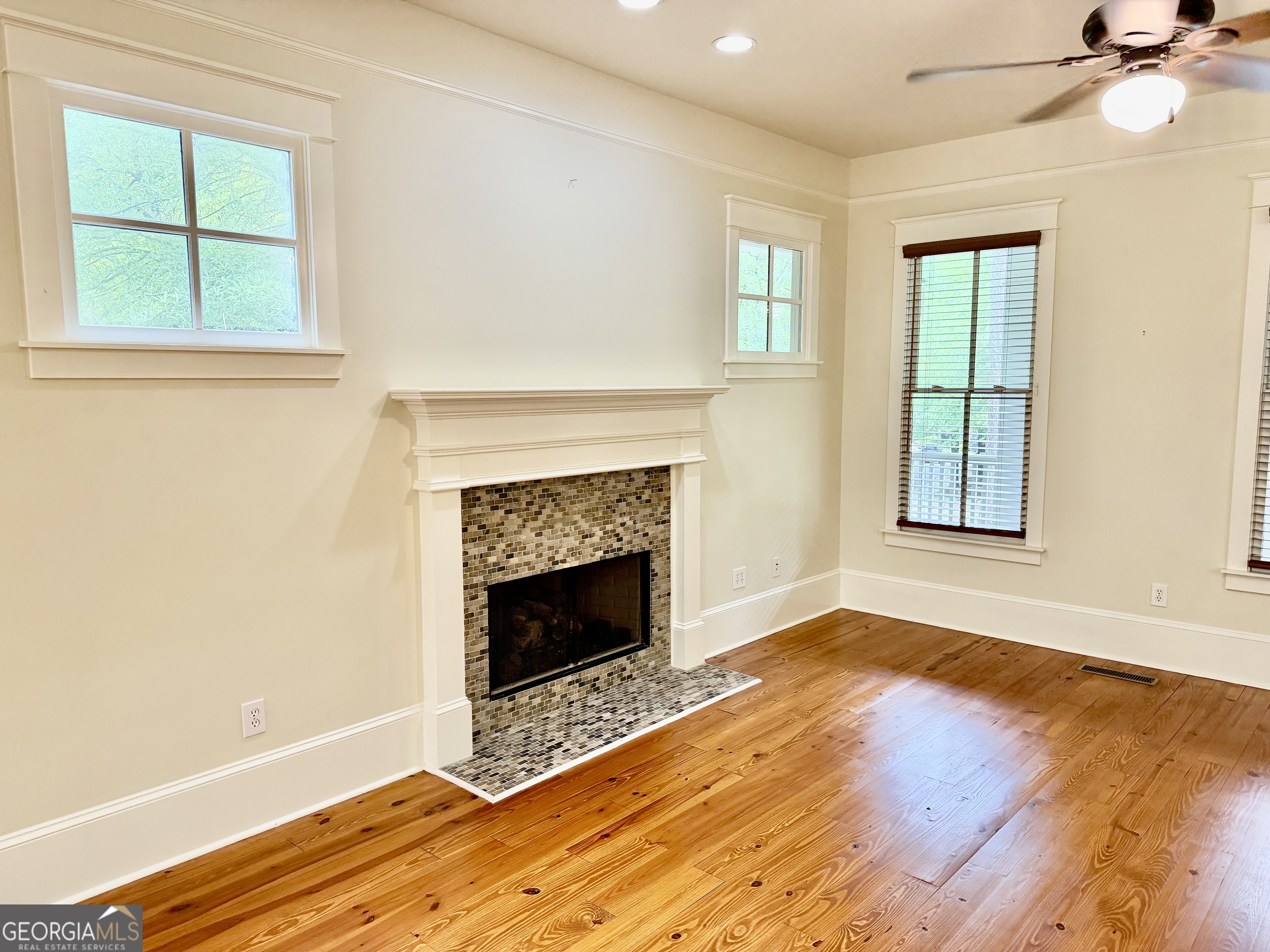 25 Charter Oak Drive Athens, GA 30607 - Photo 9 of 19 an empty room with windows and fireplace