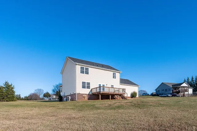 a view of a roof deck with wooden floor and fence