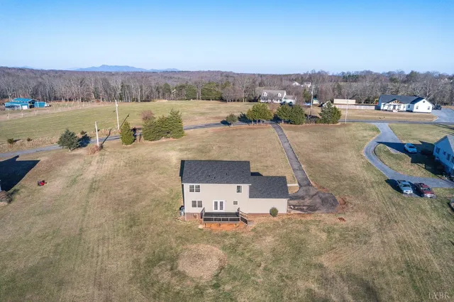 an aerial view of a swimming pool and mountain view