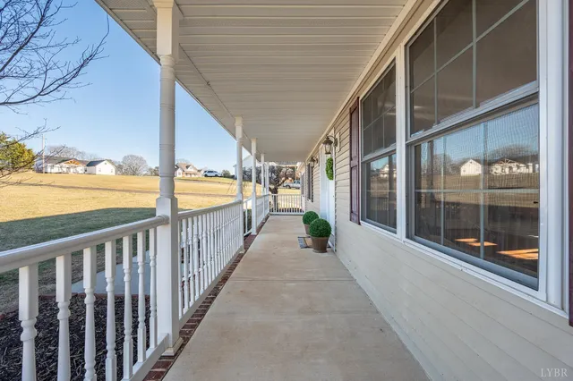 a view of a porch with wooden stairs