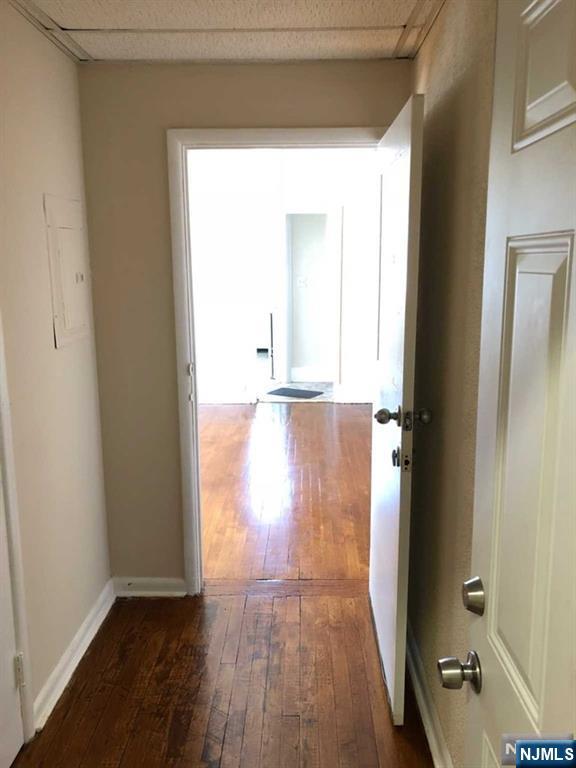 82 Park Avenue, Unit 1 Rutherford, NJ 07070 - Photo 2 of 6 an empty room with wooden floor and windows