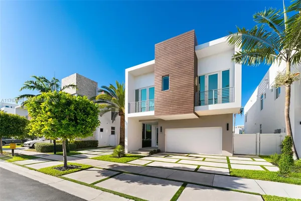 a house with a swimming pool in front of it