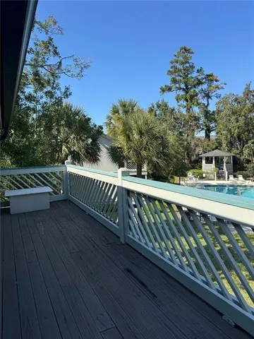 a view of balcony with wooden floor