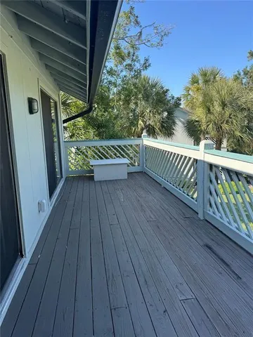 a swimming pool with outdoor seating and yard