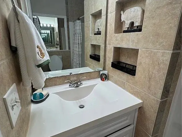 a bathroom with a sink and a mirror