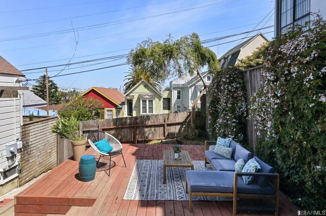 a view of house with patio outdoor seating