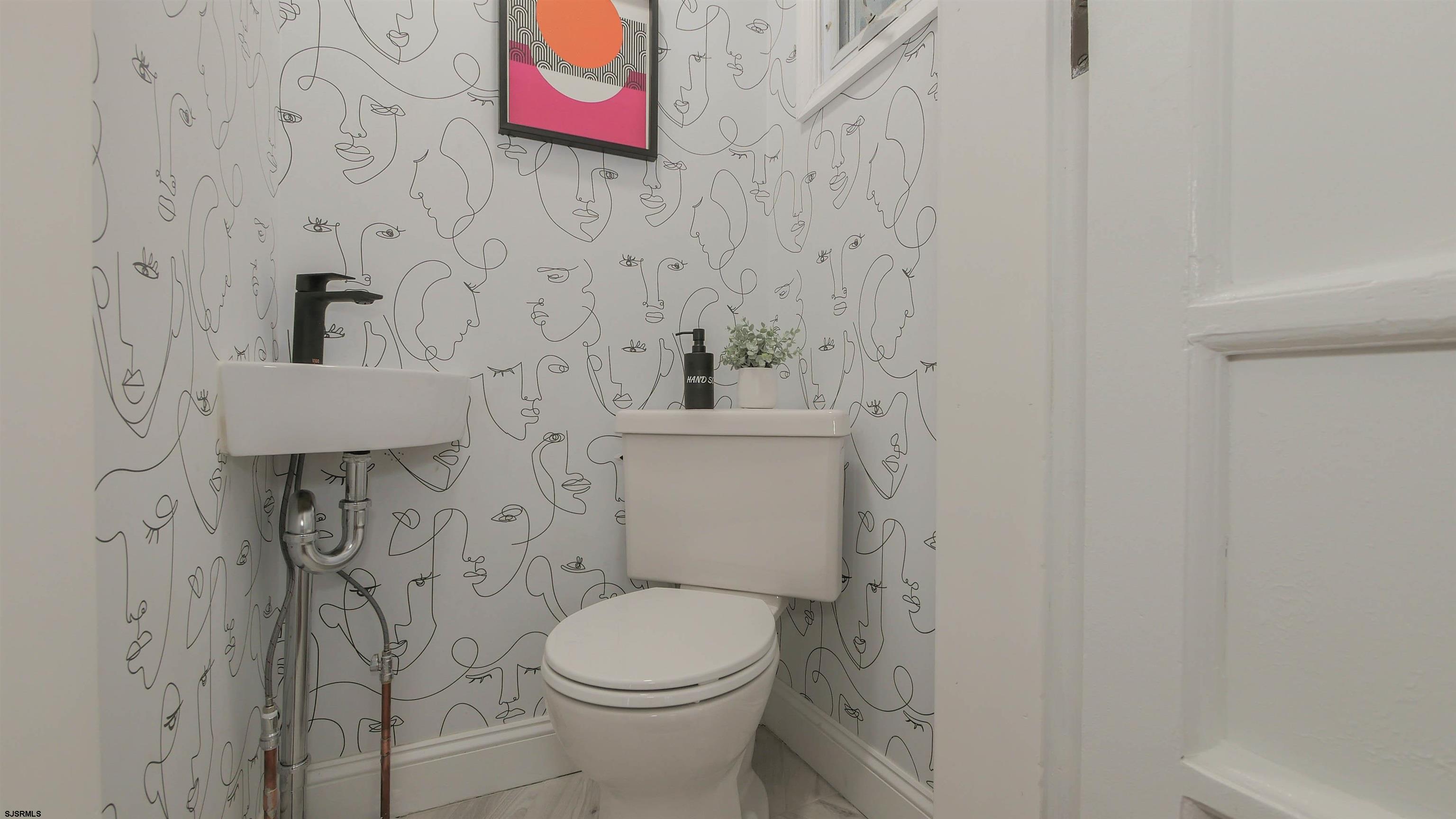 4700 Atlantic Avenue Atlantic City, NJ 08401 - Photo 25 of 74 a bathroom with a toilet and a sink