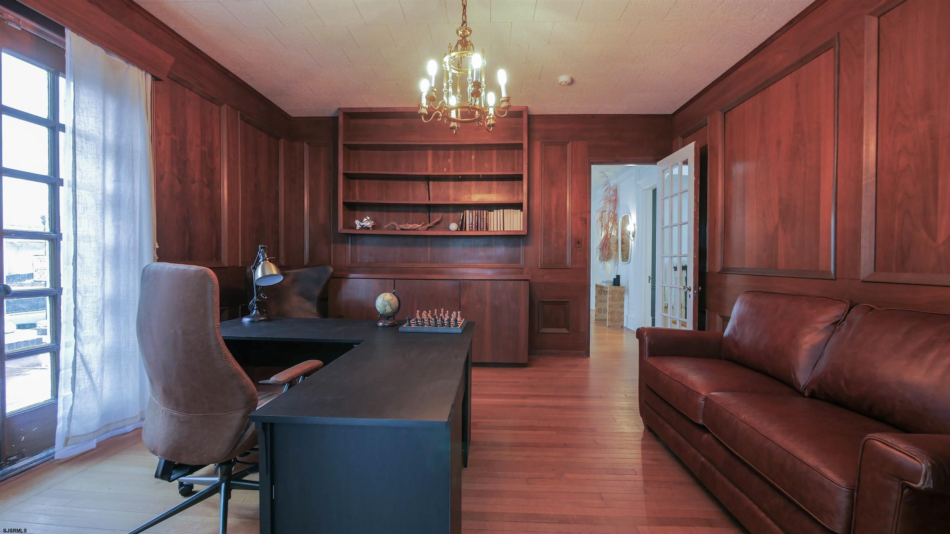 4700 Atlantic Avenue Atlantic City, NJ 08401 - Photo 27 of 74 a living room with furniture a chandelier and a window
