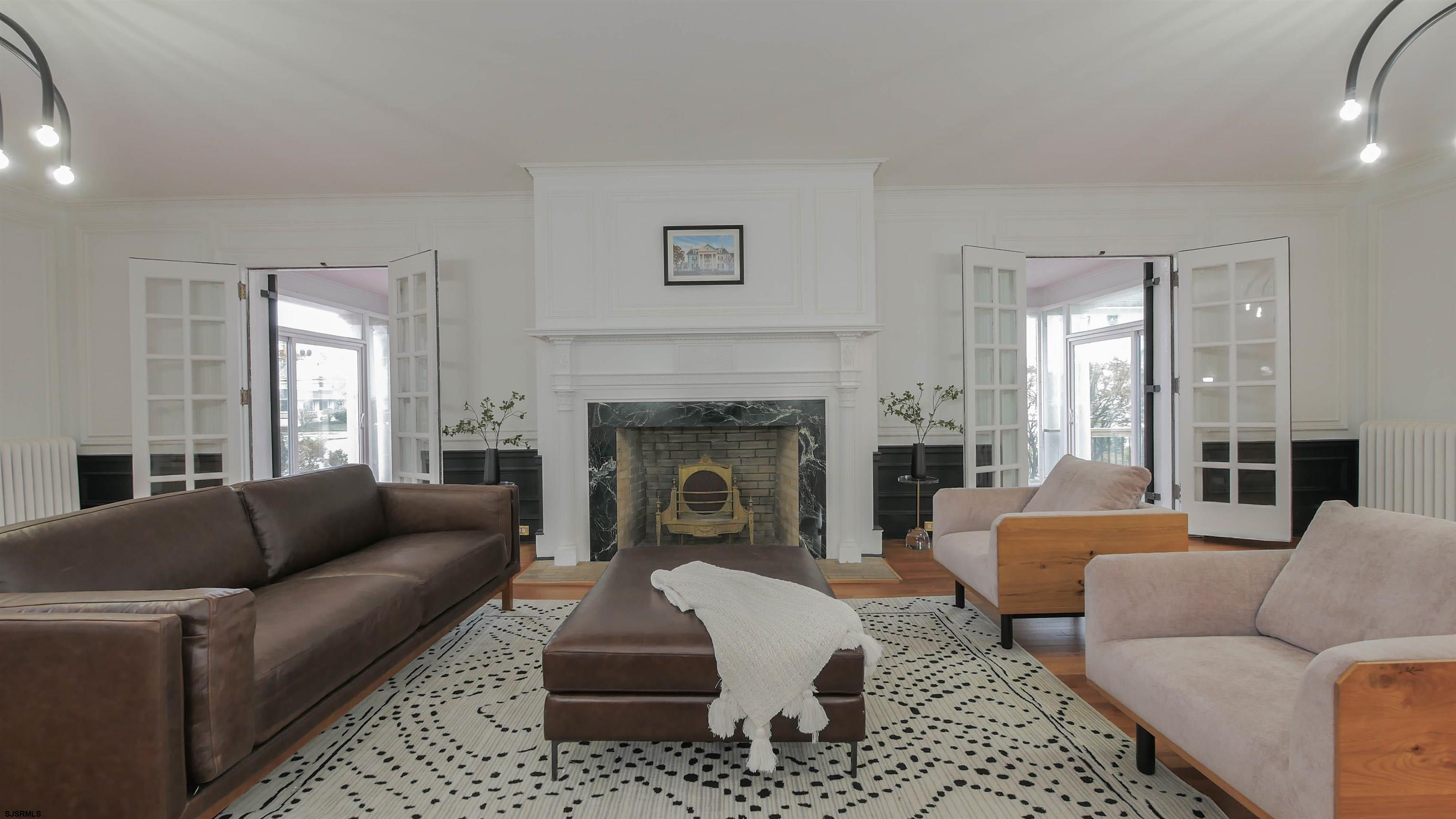 4700 Atlantic Avenue Atlantic City, NJ 08401 - Photo 29 of 74 a living room with furniture a fireplace and a large window