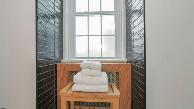 a bedroom with a bed and a table in it