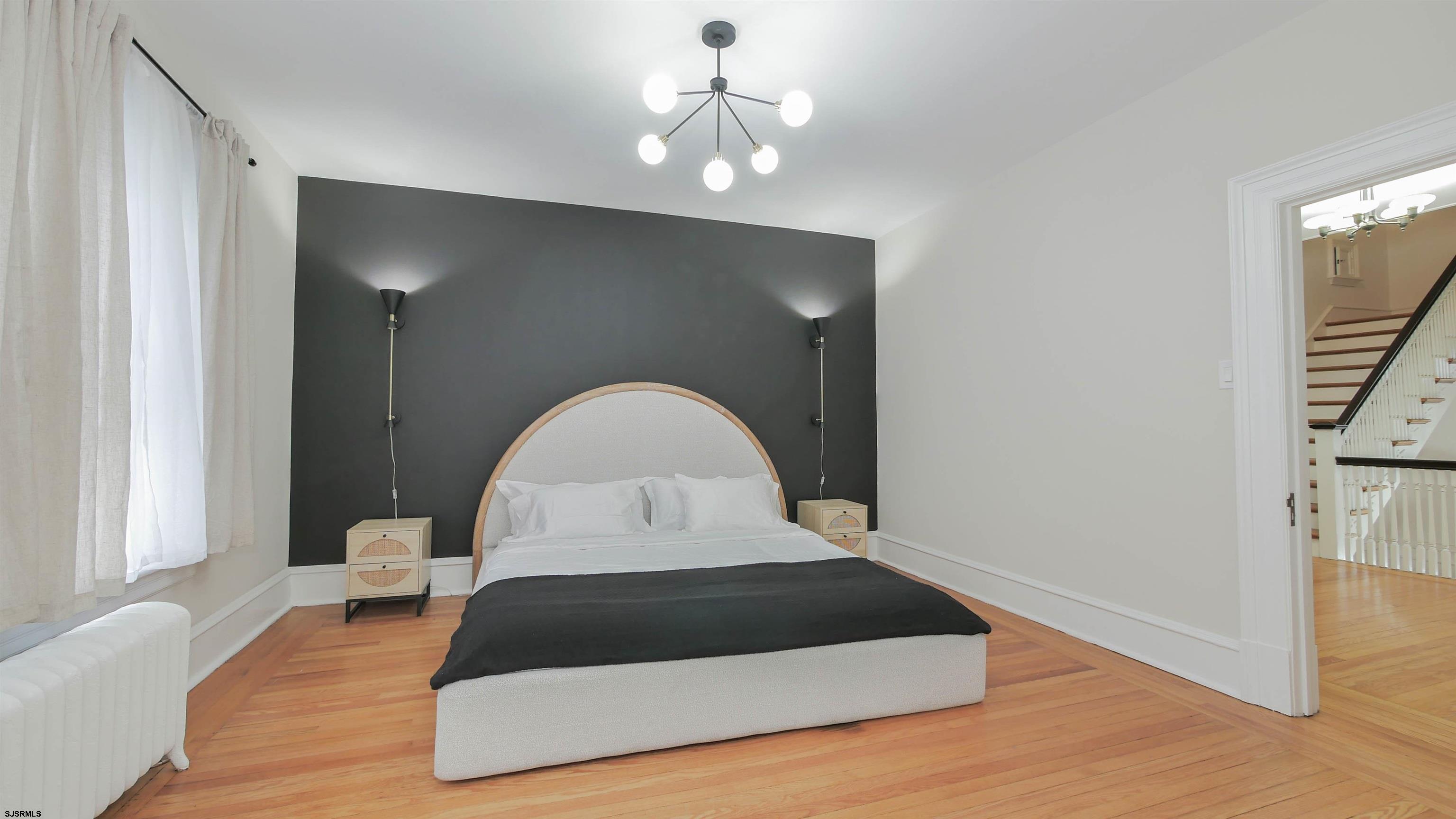 4700 Atlantic Avenue Atlantic City, NJ 08401 - Photo 46 of 74 a living room with a bed furniture and a window