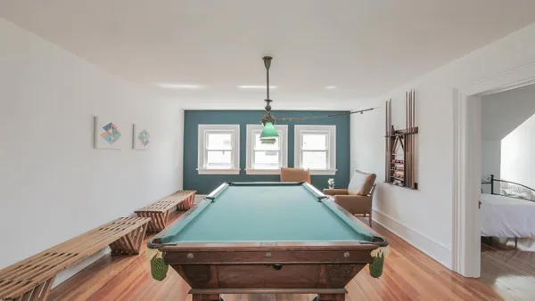 a bedroom with furniture and a window