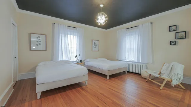 a spacious bedroom with a bed and a window
