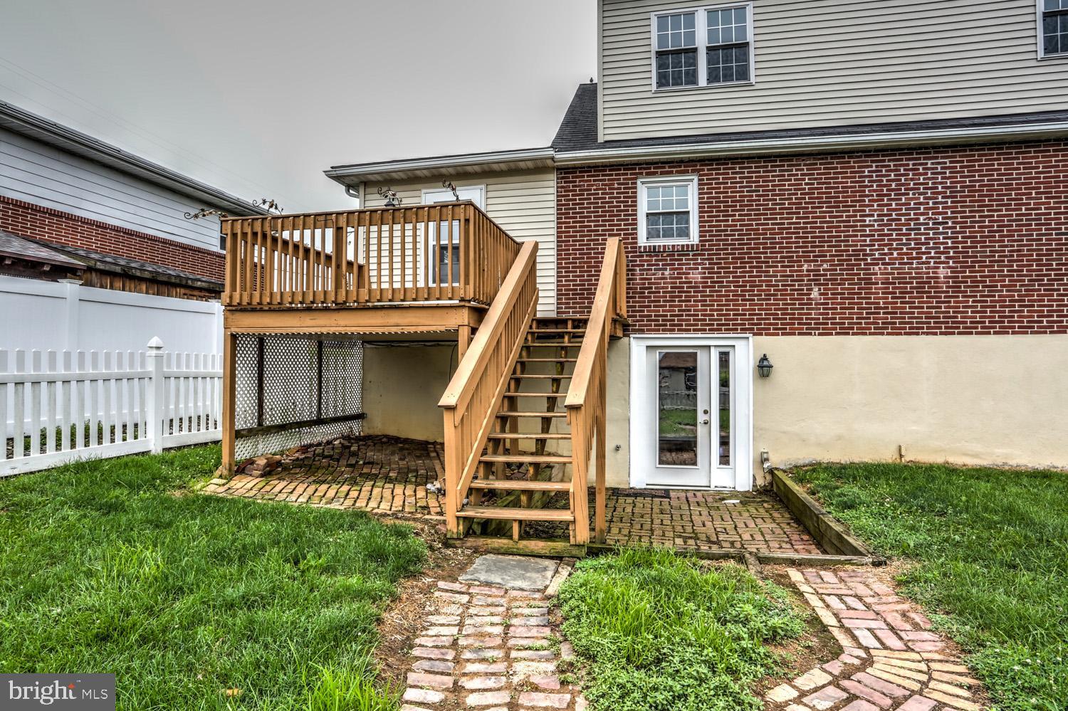 411 Haig Boulevard Reading, PA 19607 - Photo 31 of 36 Brick walkway to Deck and Basement Entrance