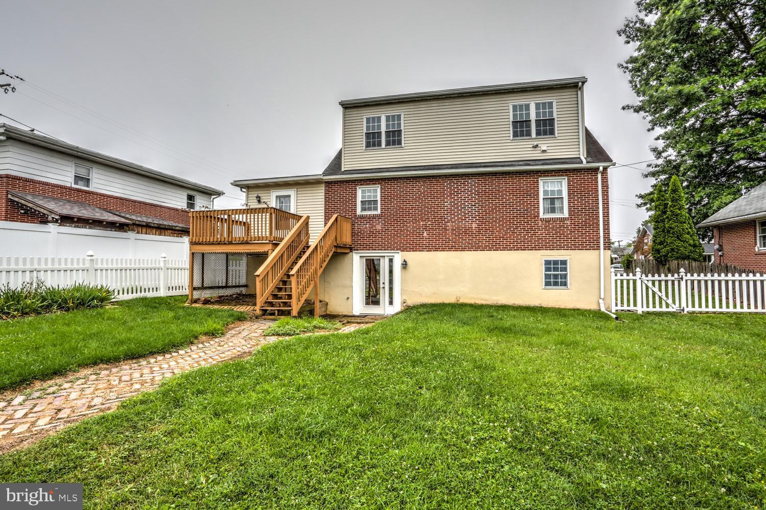411 Haig Boulevard Reading, PA 19607 - Photo 33 of 36 Rear View with Brick Walkway to Basement Entrance