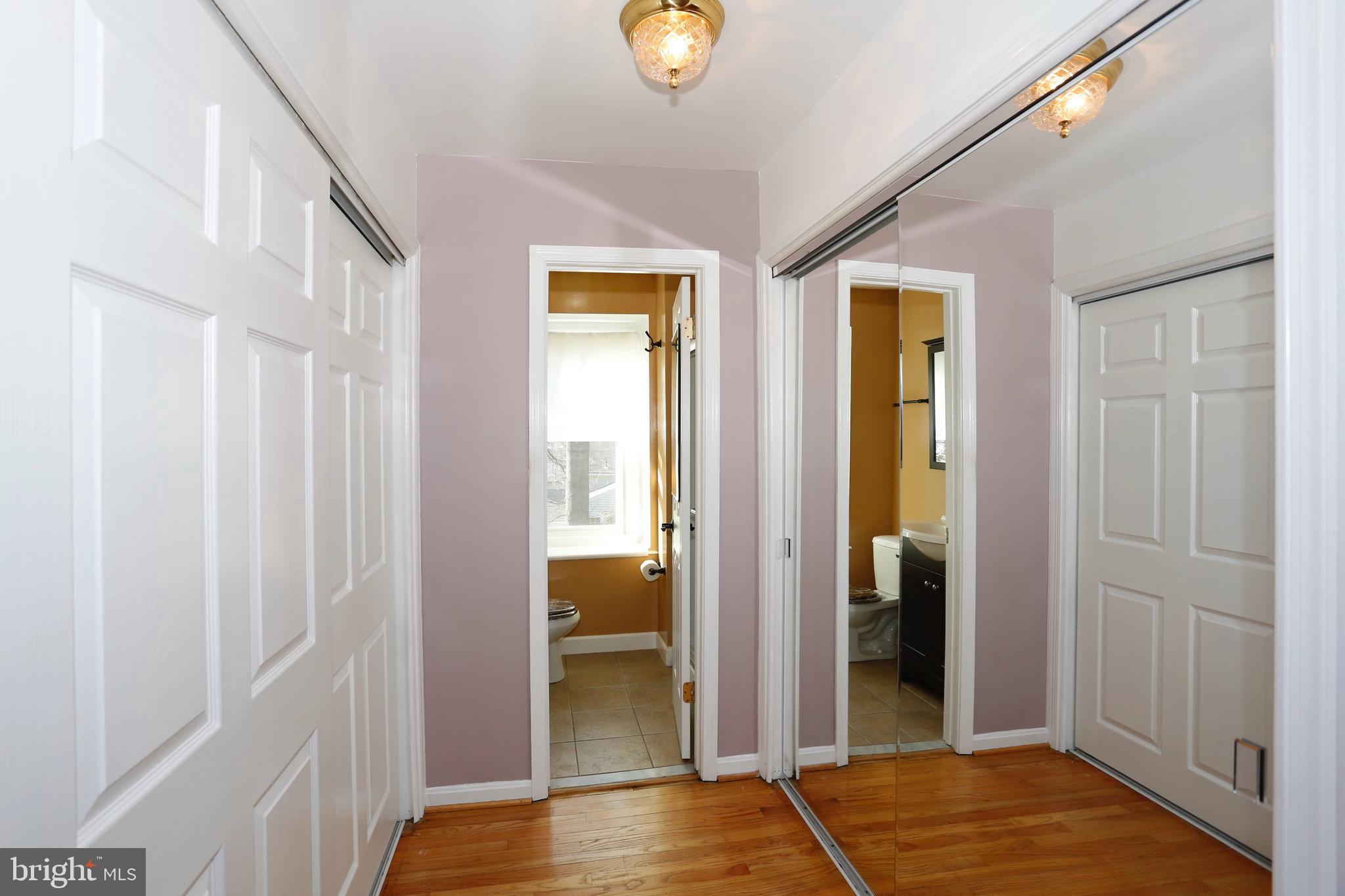 314 Summit Hall Road Gaithersburg, MD 20877 - Photo 17 of 31 Wall closets on both sides of walkway to master BA