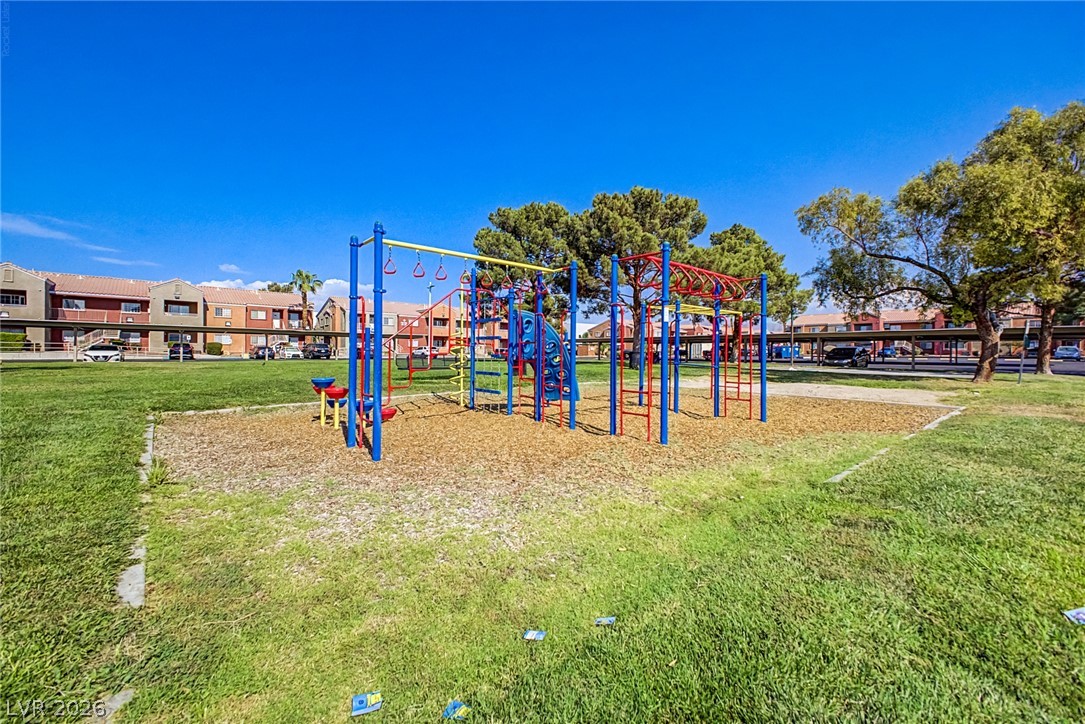 4730 East Craig Road, Unit 2096 Las Vegas, NV 89115 - Photo 31 of 35 A vibrant playground surrounded by open green space, perfect for outdoor fun.