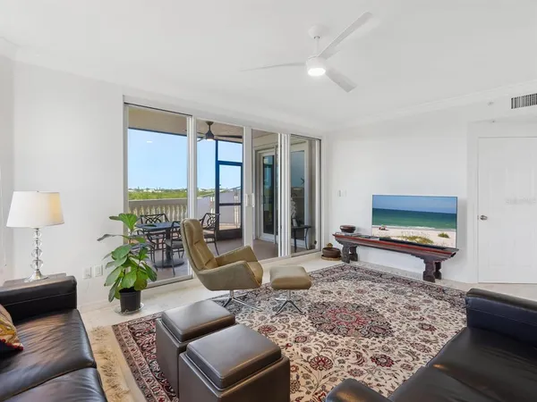 a living room with a couch and a window