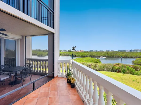 a view of a patio with table and chairs