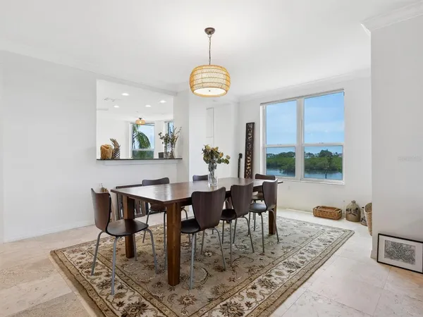 a view of a dining room with furniture window and outside view