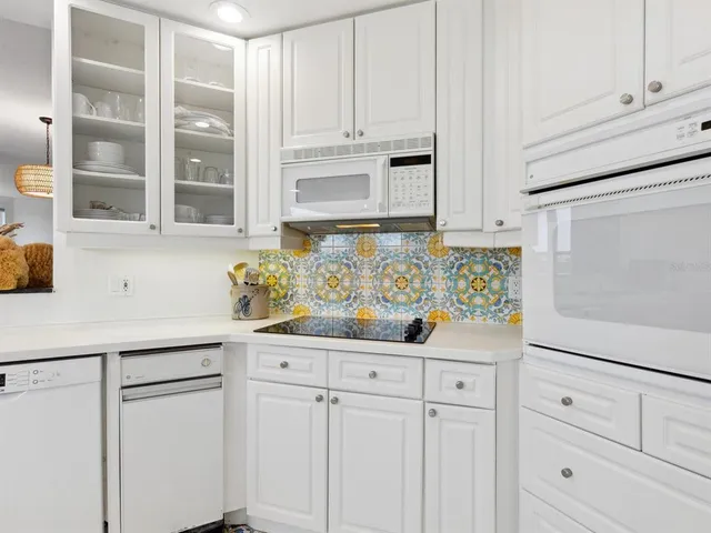 a spacious bathroom with a double vanity sink mirror and bathtub