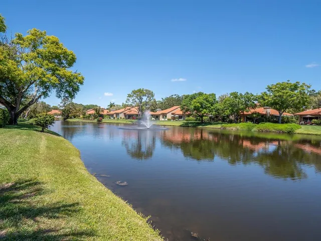 a view of a backyard with sitting area