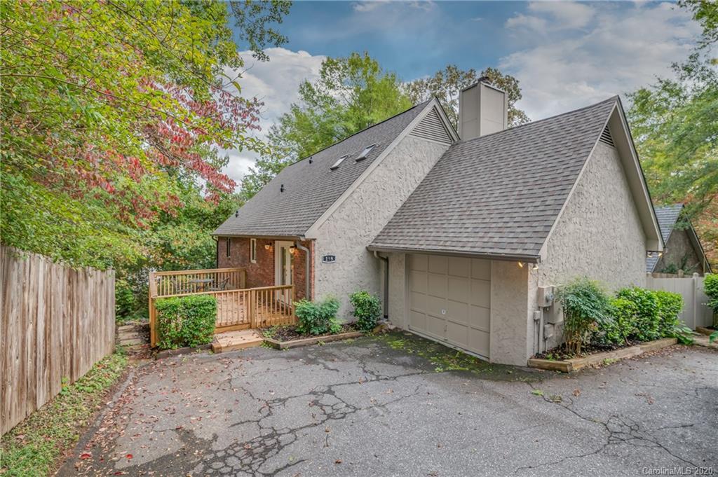 199 Chestnut Street Tryon, NC 28782 - Photo 2 of 29 a front view of a house with garden