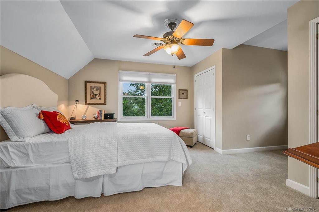 199 Chestnut Street Tryon, NC 28782 - Photo 12 of 29 a bedroom with a bed and a window