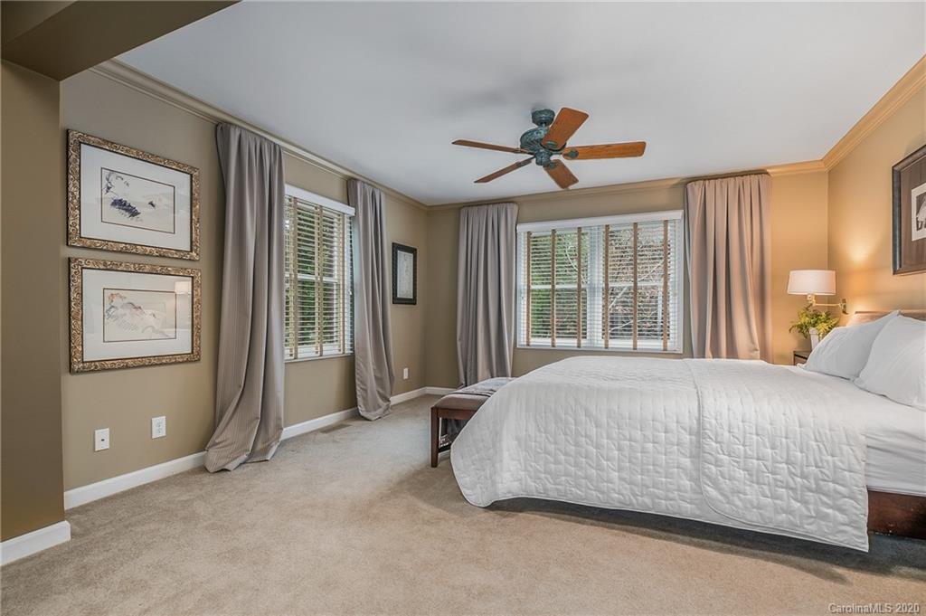 199 Chestnut Street Tryon, NC 28782 - Photo 16 of 29 a bedroom with a bed and a window