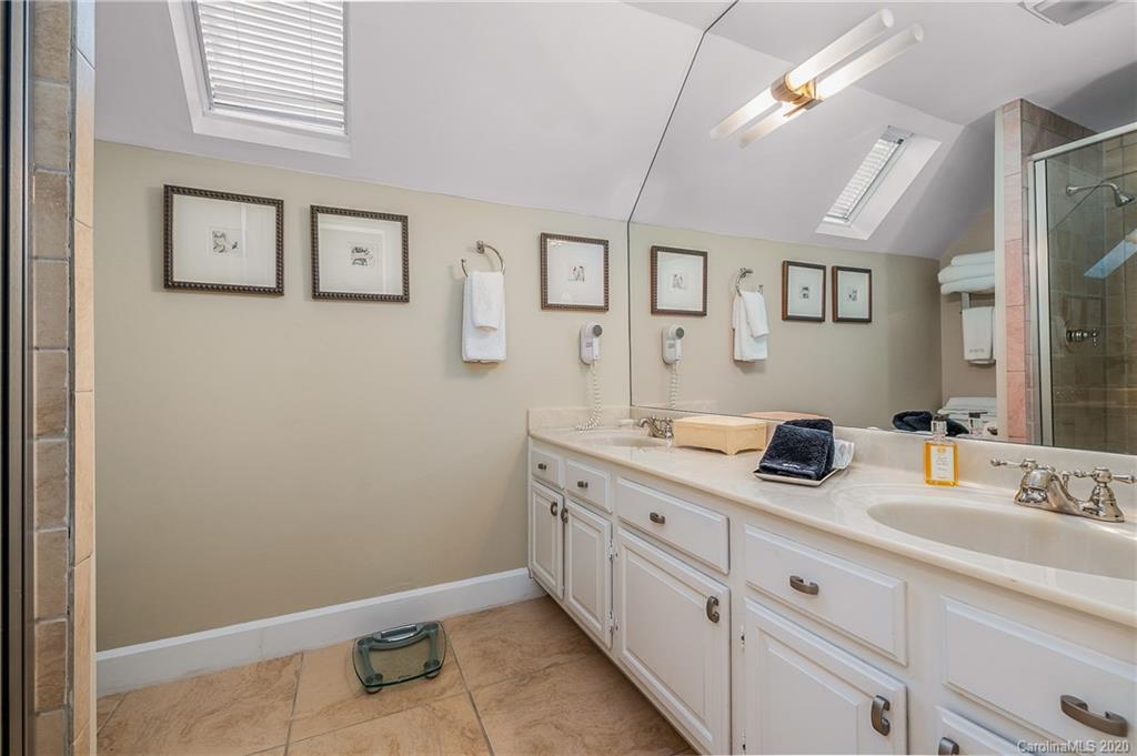 199 Chestnut Street Tryon, NC 28782 - Photo 22 of 29 a bathroom with a sink and a mirror
