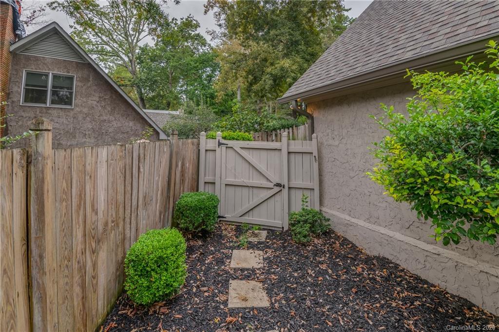 199 Chestnut Street Tryon, NC 28782 - Photo 28 of 29 a backyard of a house with lots of green space