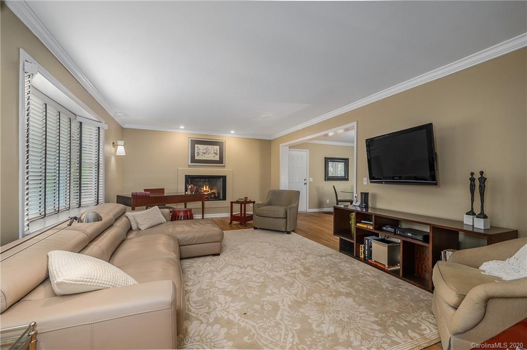 199 Chestnut Street Tryon, NC 28782 - Photo 4 of 29 a living room with furniture and a flat screen tv