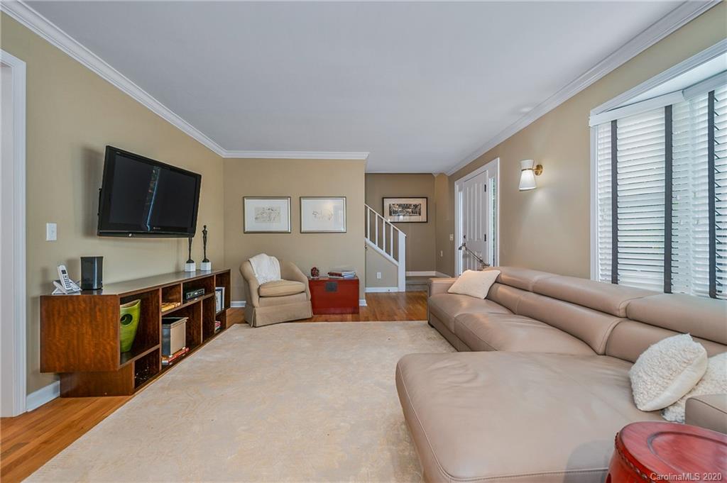 199 Chestnut Street Tryon, NC 28782 - Photo 5 of 29 a living room with furniture and a flat screen tv
