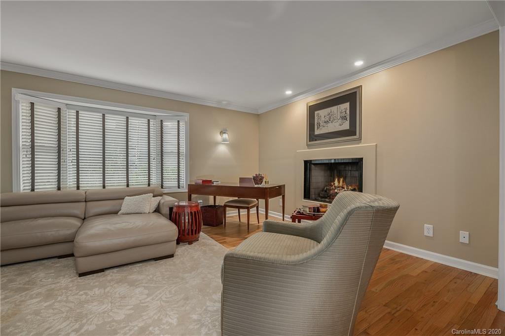 199 Chestnut Street Tryon, NC 28782 - Photo 6 of 29 a living room with furniture and a fireplace