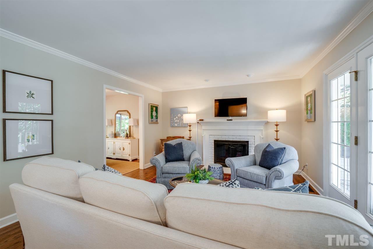 808 Davidson Street Raleigh, NC 27609 - Photo 12 of 30 a living room with furniture and a fireplace