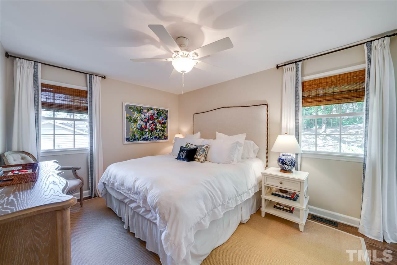 808 Davidson Street Raleigh, NC 27609 - Photo 13 of 30 a bedroom with a bed and a window