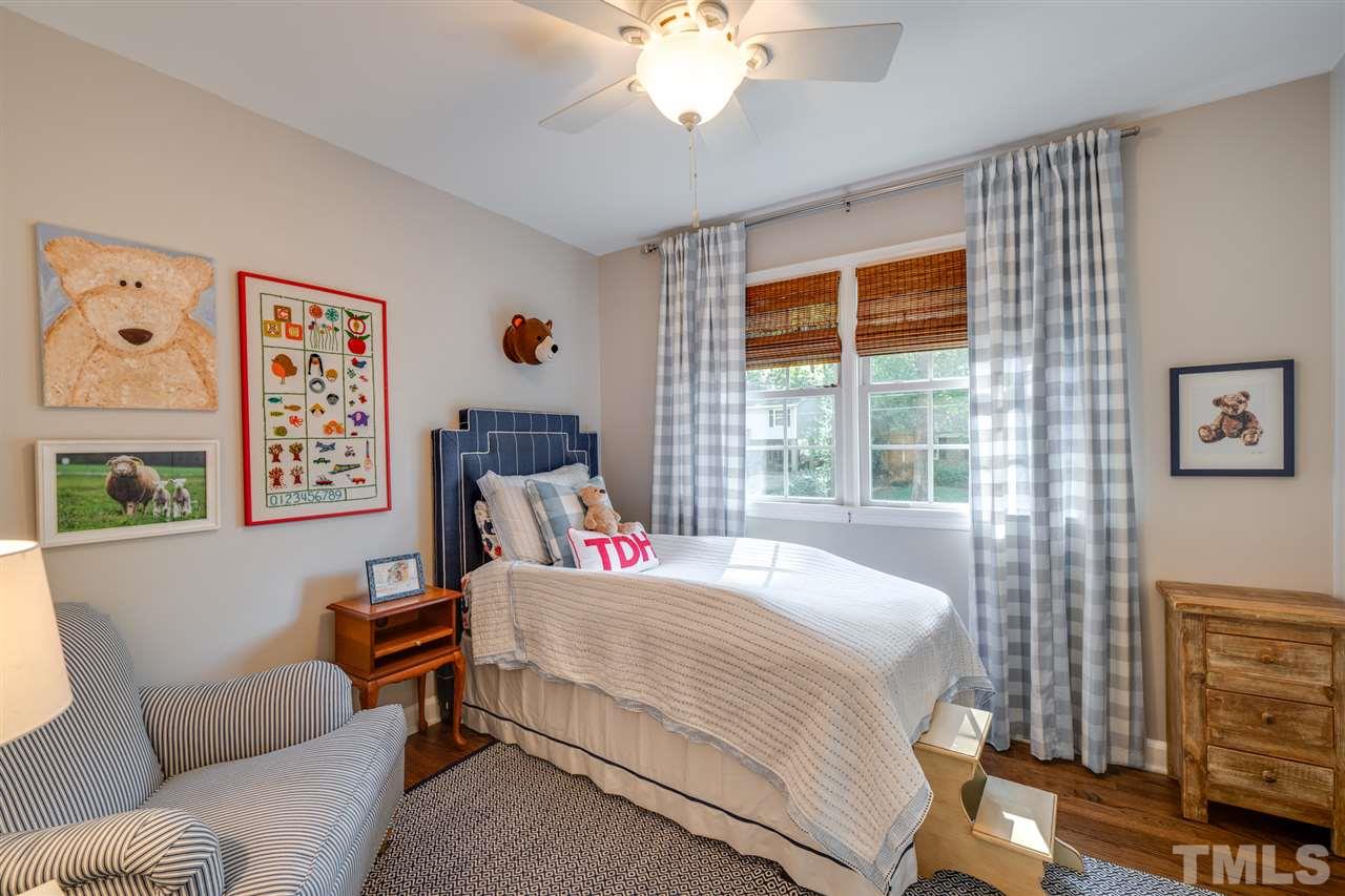 808 Davidson Street Raleigh, NC 27609 - Photo 19 of 30 a bedroom with a bed and a couch