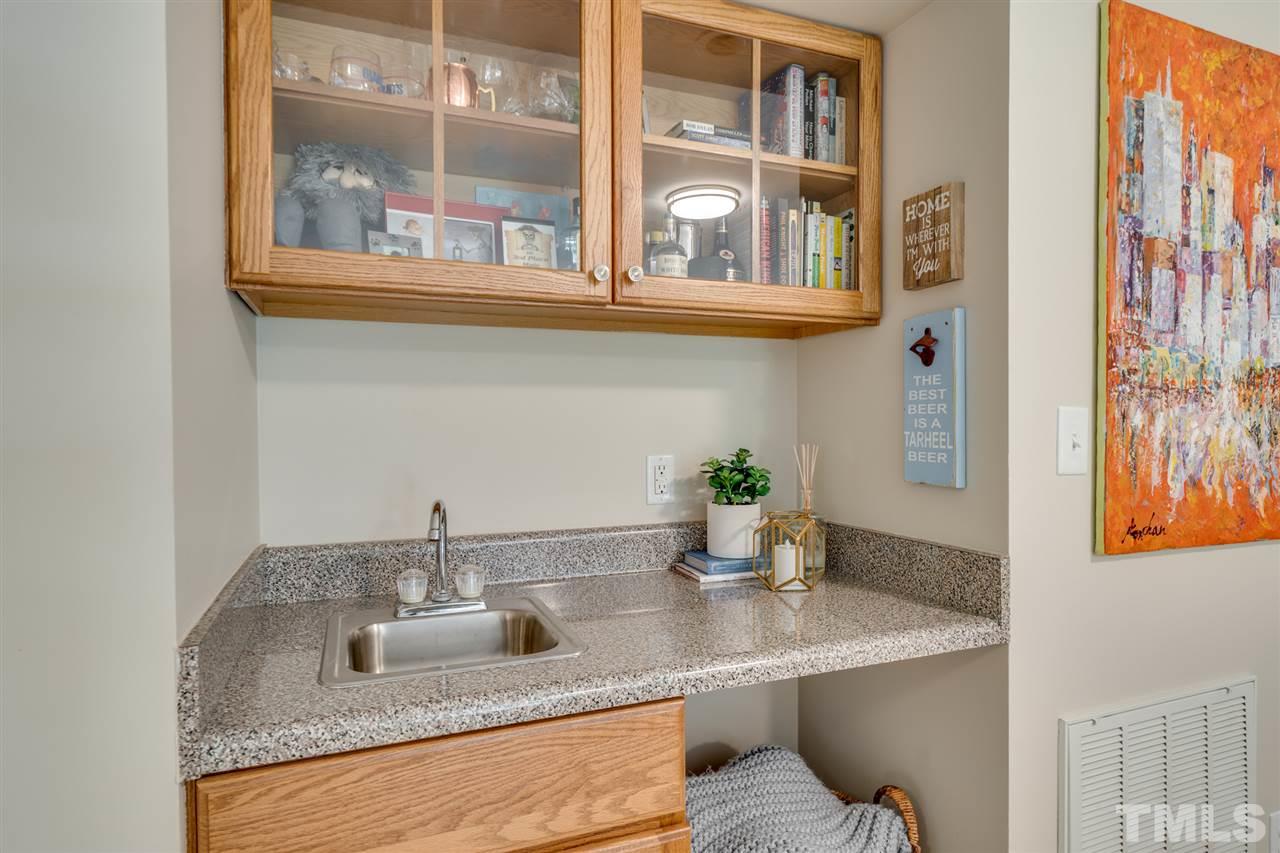 808 Davidson Street Raleigh, NC 27609 - Photo 23 of 30 a kitchen with granite countertop a sink and a window