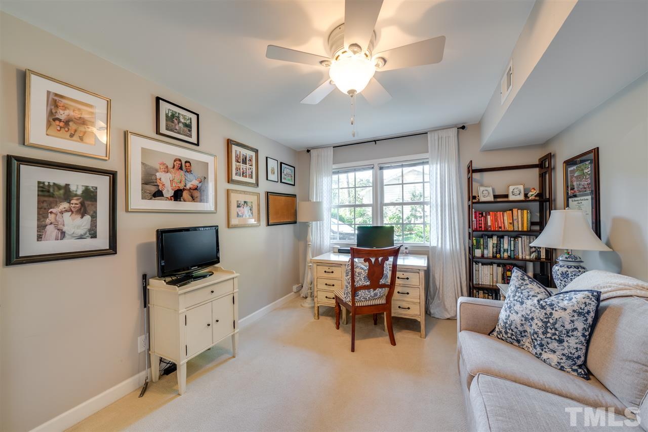 808 Davidson Street Raleigh, NC 27609 - Photo 25 of 30 a living room with furniture and a flat screen tv