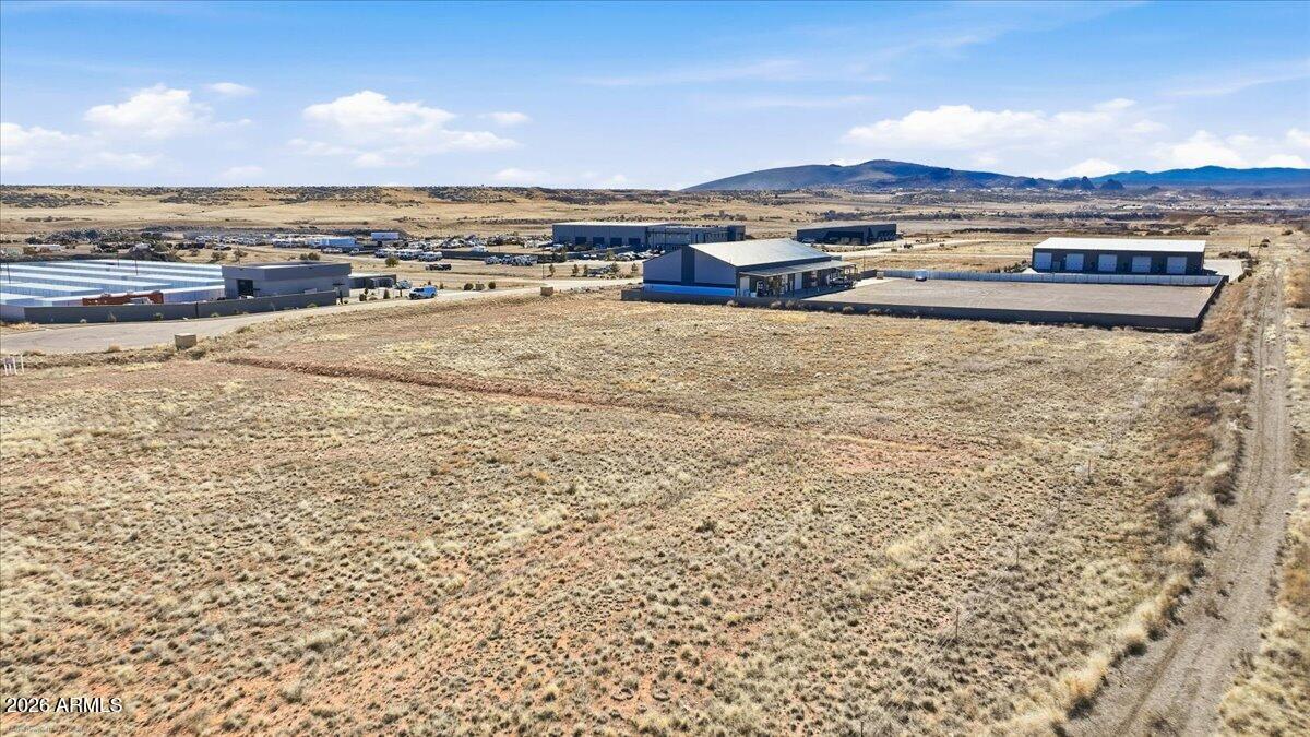 6734 Generation Lane, Unit 8 Prescott, AZ 86301 - Photo 15 of 18 an aerial view of residential houses with outdoor space