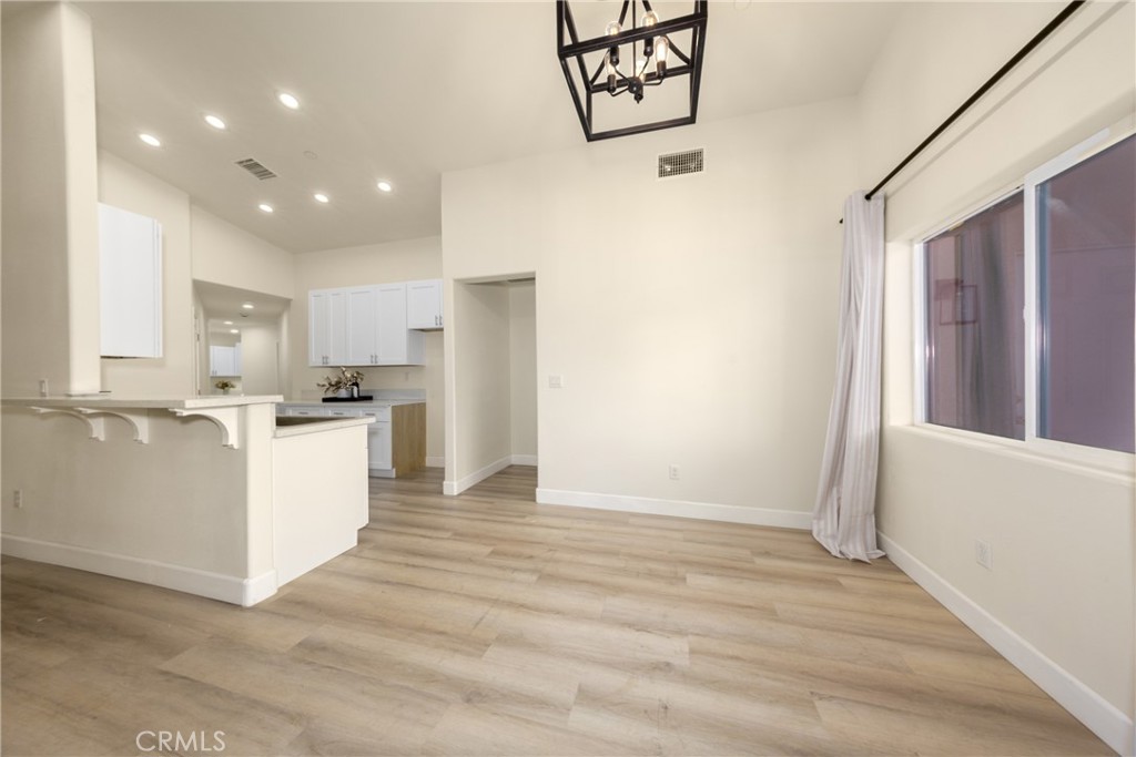 16241 Chestnut Street Hesperia, CA 92345 - Photo 15 of 60 a view of kitchen with stainless steel appliances cabinets and wooden floor