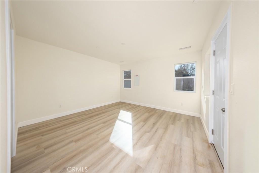 16241 Chestnut Street Hesperia, CA 92345 - Photo 20 of 60 a view of wooden floor in a room