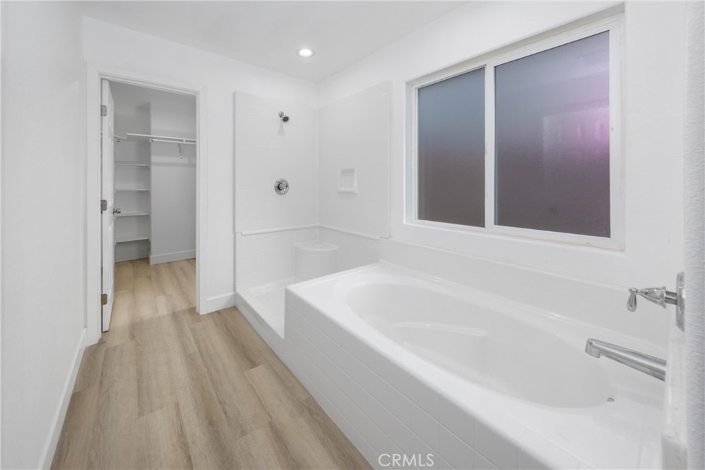 16241 Chestnut Street Hesperia, CA 92345 - Photo 23 of 60 a bathroom with a bathtub and a shower