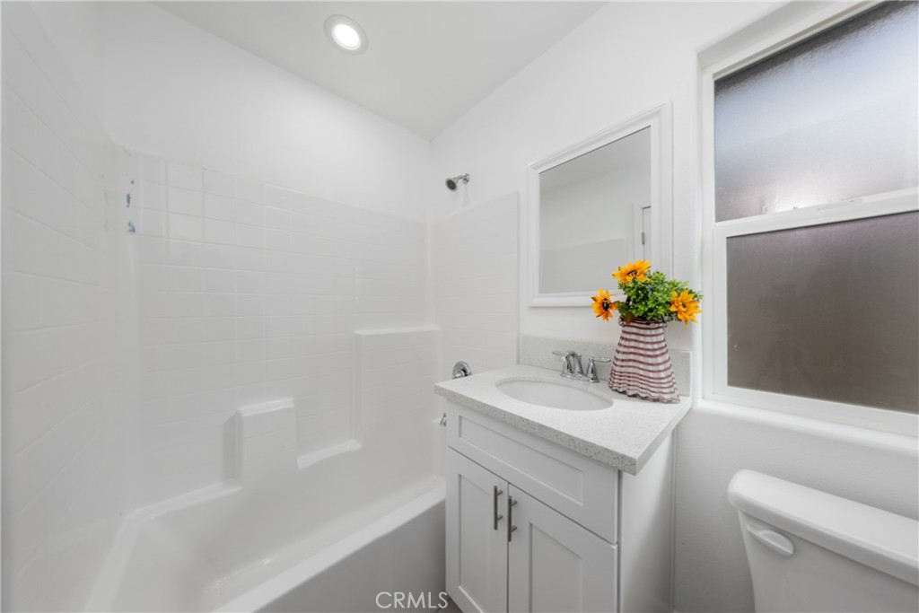16241 Chestnut Street Hesperia, CA 92345 - Photo 26 of 60 a bathroom with a sink toilet and tub