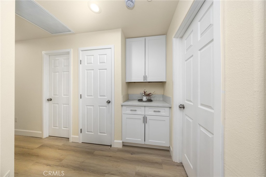 16241 Chestnut Street Hesperia, CA 92345 - Photo 33 of 60 a view of a kitchen with white cabinets