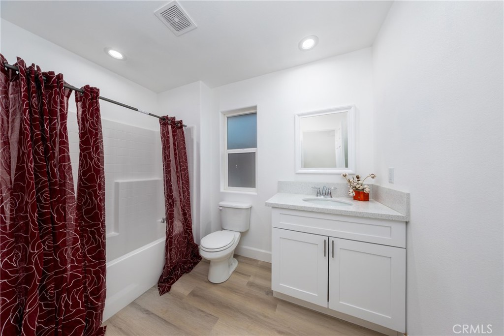 16241 Chestnut Street Hesperia, CA 92345 - Photo 36 of 60 a bathroom with a sink toilet and shower