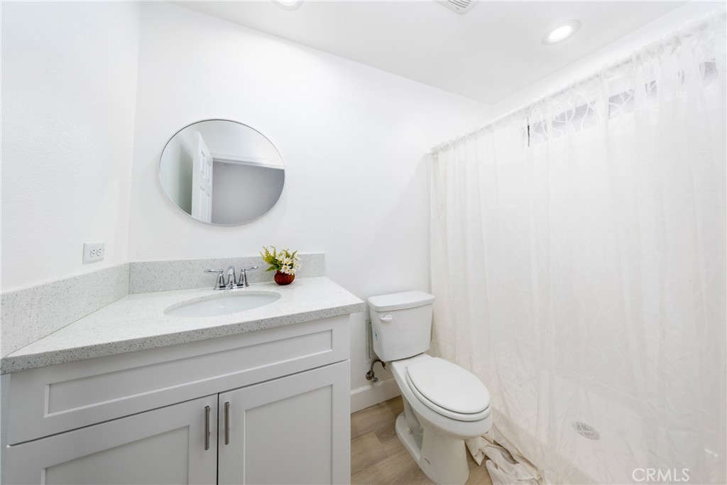 16241 Chestnut Street Hesperia, CA 92345 - Photo 48 of 60 a bathroom with a sink a toilet and a mirror